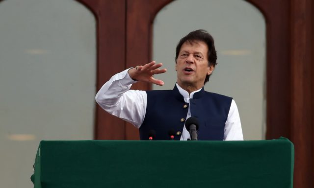 Pakistan's Prime Minister Imran Khan addresses the nation outside the Prime Minister's Office in Islamabad on August 30, 2019. - Prime Minister Imran Khan vowed to continue fighting for Kashmir until the disputed Himalayan territory was "liberated" as thousands rallied across Pakistan on August 30 in mass demonstrations protesting Delhi's actions in Indian-administered Kashmir in the most ambitious public protests targeting India in years. (Photo by AAMIR QURESHI / AFP)