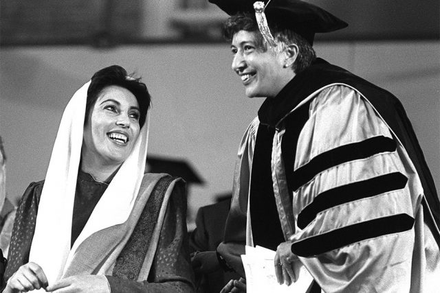Benazir Bhutto, left, and Martina Horner, president of Radcliffe, share a moment at Commencement in 1989. Bhutto served as Prime Minister of Pakistan, the first woman elected to lead a Muslim state. She was later assassinated in 2007. Matina Horner was an American psychologist who became the sixth president of Radcliffe College in 1972.