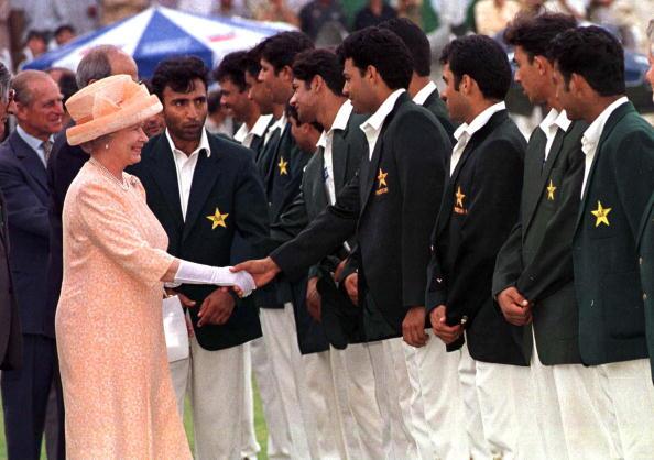 Queen meets members of the Pakistan cricket team at the Rawalpindi cricket ground, in 1997.