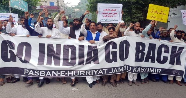 Civil-society-activists-chant-slogans-at-a-rally-organised-by-Pasban-e-Hurriyat-Jammu-Kashmir-in-Muzaffarabad.