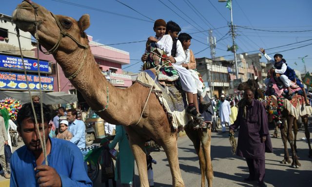 Children-sit-on-camels-as-they-participate-in-a-procession-to-celebrate-the-birth-of-the-Holy-Prophet-PBUH-in-Karachi-on-Sunday.