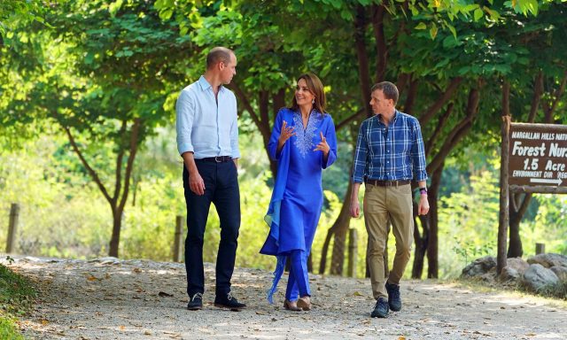 Britain's Prince William and Catherine, Duchess of Cambridge walk with an unidentified man during a visit to the Margalla Hills in Islamabad, Pakistan, October 15, 2019.