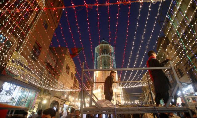 Markets are decorated with lights for the Mawlid al-Nabi holiday celebrating the birthday of Islam's prophet, Muhammad, born in the year 570, Tuesday, Nov. 20, 2018, in Peshawar, Pakistan. Thousands of Pakistani Muslims will take part on Wednesday in religious processions, ceremonies and distributing free meals among the poor. (AP Photo/Muhammad Sajjad)