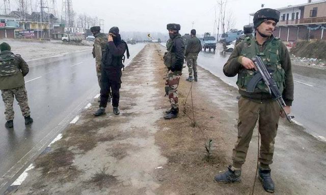 Indian paramilitary soldiers patrol near the site of an explosion in Pampore, Indian-controlled Kashmir, Thursday, Feb. 14, 2019. Security officials say at least 10 soldiers have been killed and 20 others wounded by a large explosion that struck a paramilitary convoy on a key highway on the outskirts of the disputed region's main city of Srinagar.