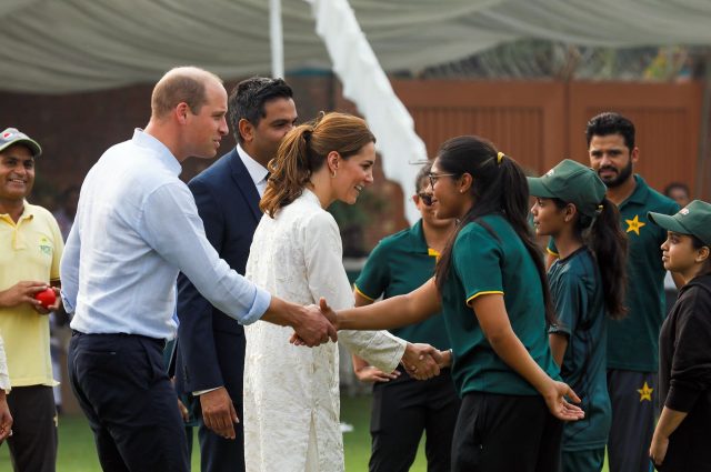 Britain's Prince William and Catherine, Duchess of Cambridge, shake hands with children participants of the British Council's DOSTI (friendship) program at the National Cricket Academy in Lahore, Pakistan October 17, 2019.