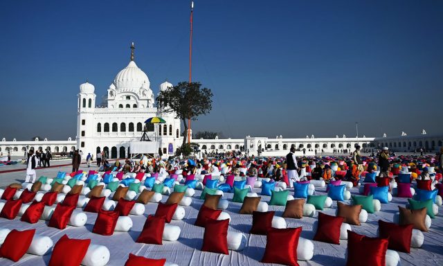 Sitting places with pillows are set out for Sikh pilgrims to attend a ceremomy for the inauguration of the Shrine of Baba Guru Nanak Dev at Gurdwara Darbar Sahib in Kartarpur, near the Indian border, on November 9, 2019. - Hundreds of Indian Sikhs prepared to make a historic pilgrimage to Pakistan on November 9 crossing to one of their religion's holiest sites under a landmark deal between the two countries separated by the 1947 partition of the subcontinent. (Photo by AAMIR QURESHI / AFP)