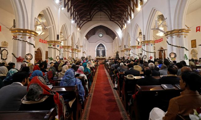 People-attend-a-Christmas-Day-service-at-the-St.-Johns-Cathedral-in-Peshawa