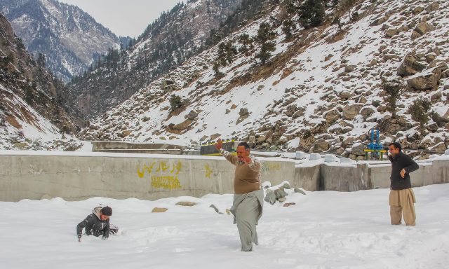 Tourists celebrate in knee-deep snow in Kalam valley